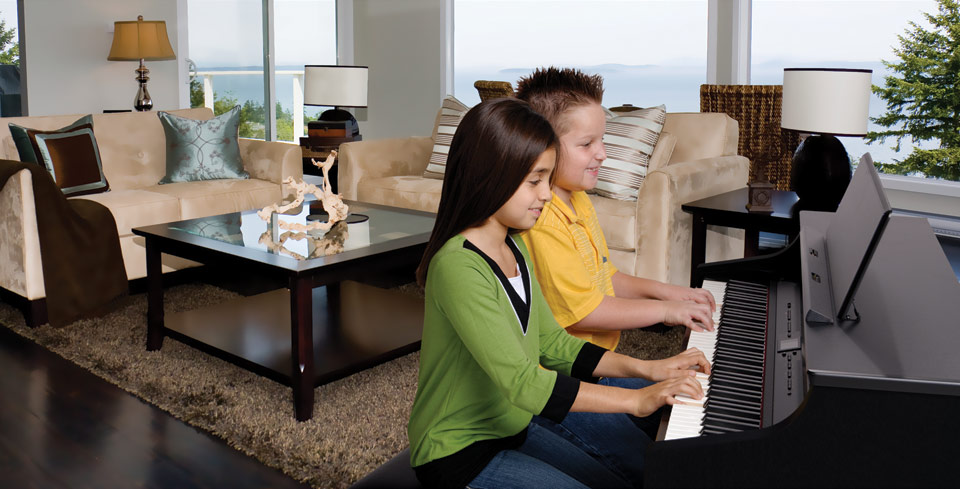 Children playing Roland HP-307 in living room