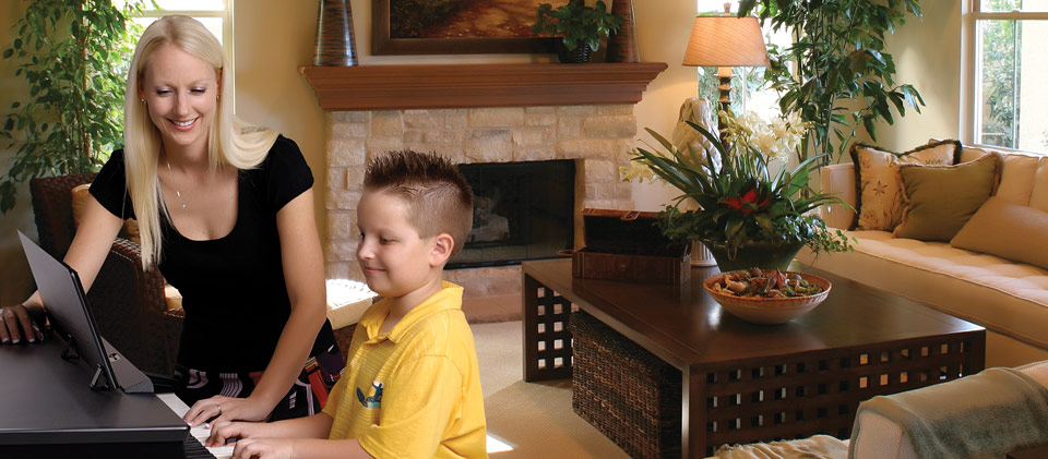 Child and teacher playing RG-1F in living room